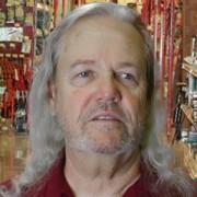Older man with shoulder-length gray hair